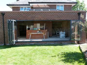 WEST DERBY , LIVERPOOL. Installation of Allstyle Alumnium Bi folding doors. Double glazed with Celsius clear , self cleaning double glazed units. 